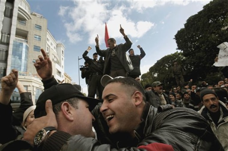 Police officers join the celebrations on Jan. 22 after the fall of Tunisian strongman Zine El Abidine Ben Ali.